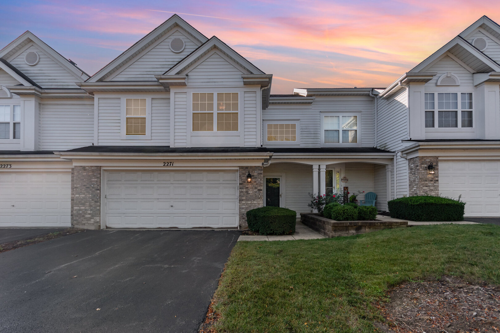 2271 Scott Lane Aurora, IL 60502 - Photo 1 of 18 a front view of a house with a garden and plants