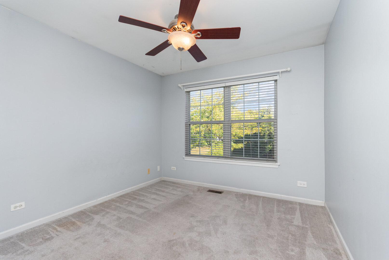 2271 Scott Lane Aurora, IL 60502 - Photo 11 of 18 an empty room with a window and a fan