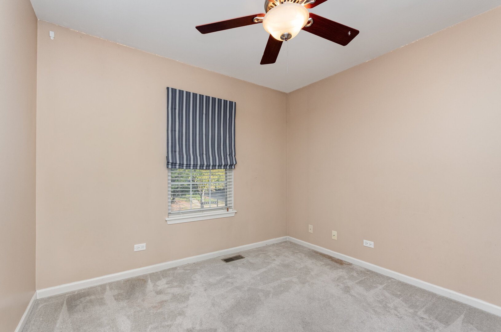 2271 Scott Lane Aurora, IL 60502 - Photo 12 of 18 an empty room with a window and a fan