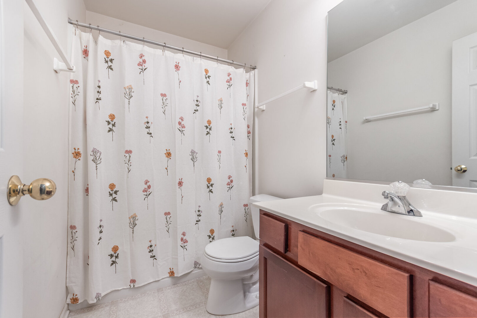 2271 Scott Lane Aurora, IL 60502 - Photo 13 of 18 a bathroom with a sink a toilet and shower curtain