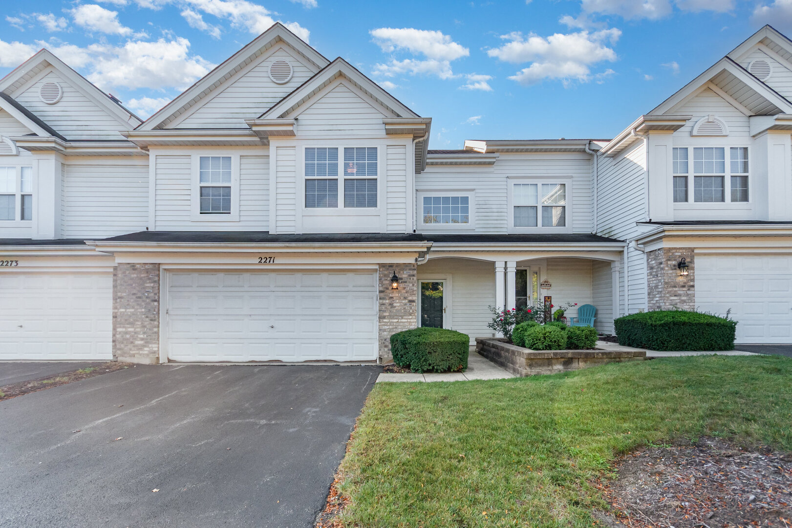 2271 Scott Lane Aurora, IL 60502 - Photo 2 of 18 a front view of a house with a yard and garage