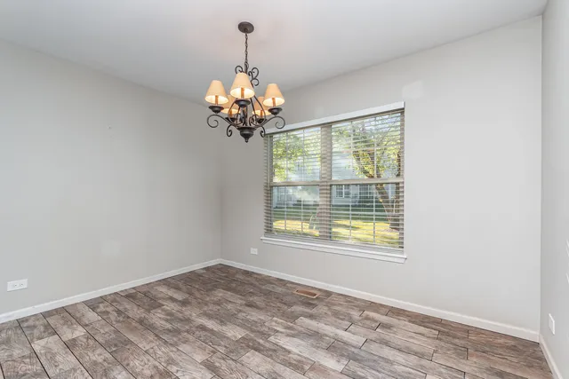 a kitchen with stainless steel appliances granite countertop wooden cabinets a stove top oven a sink and dishwasher