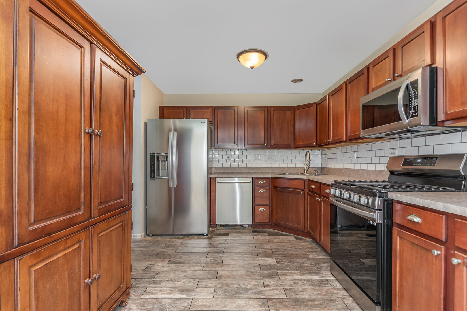2271 Scott Lane Aurora, IL 60502 - Photo 7 of 18 a kitchen with stainless steel appliances granite countertop a refrigerator and a sink