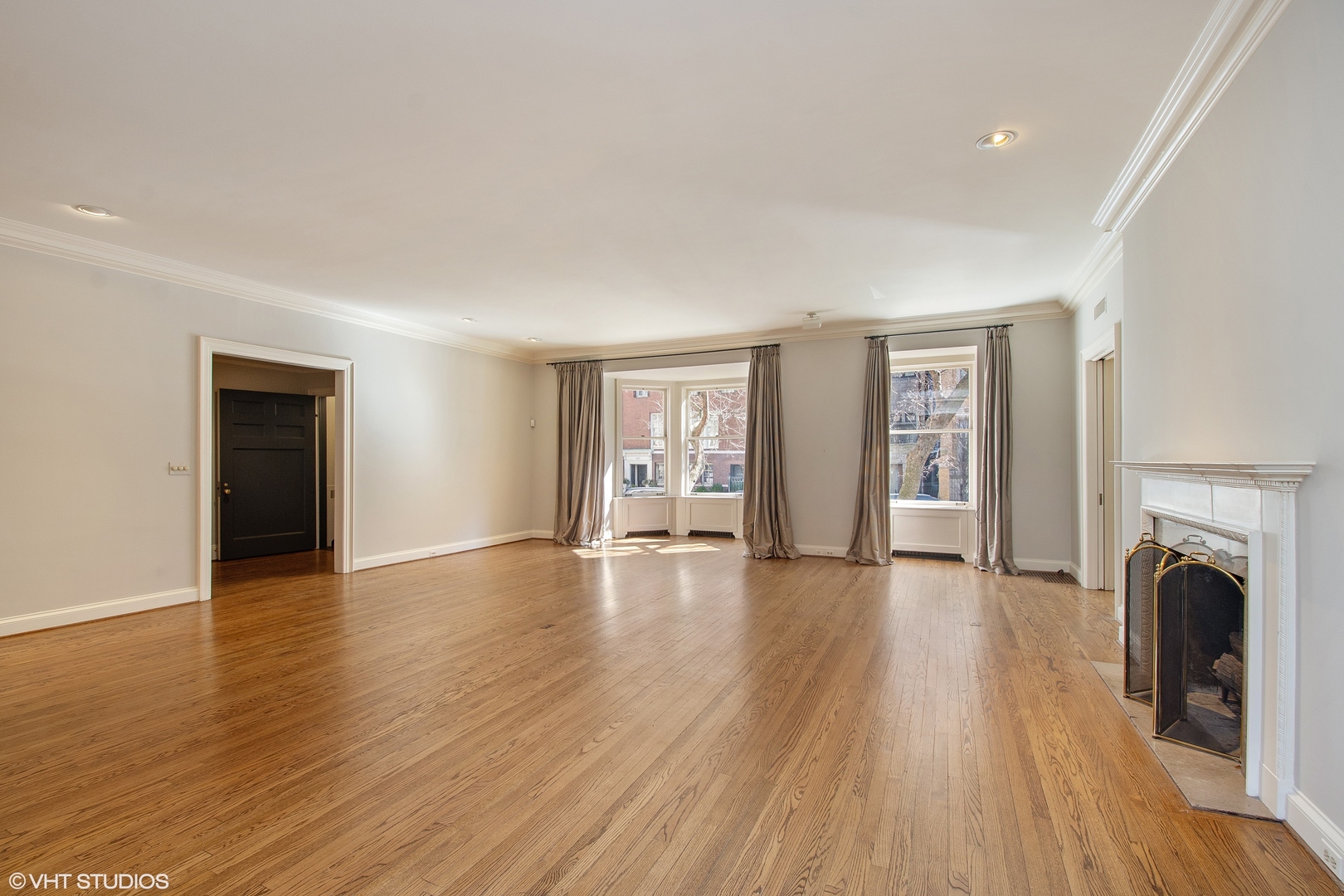 1442 North Astor Street Chicago, IL 60610 - Photo 15 of 55 a view of empty room with wooden floor and fireplace