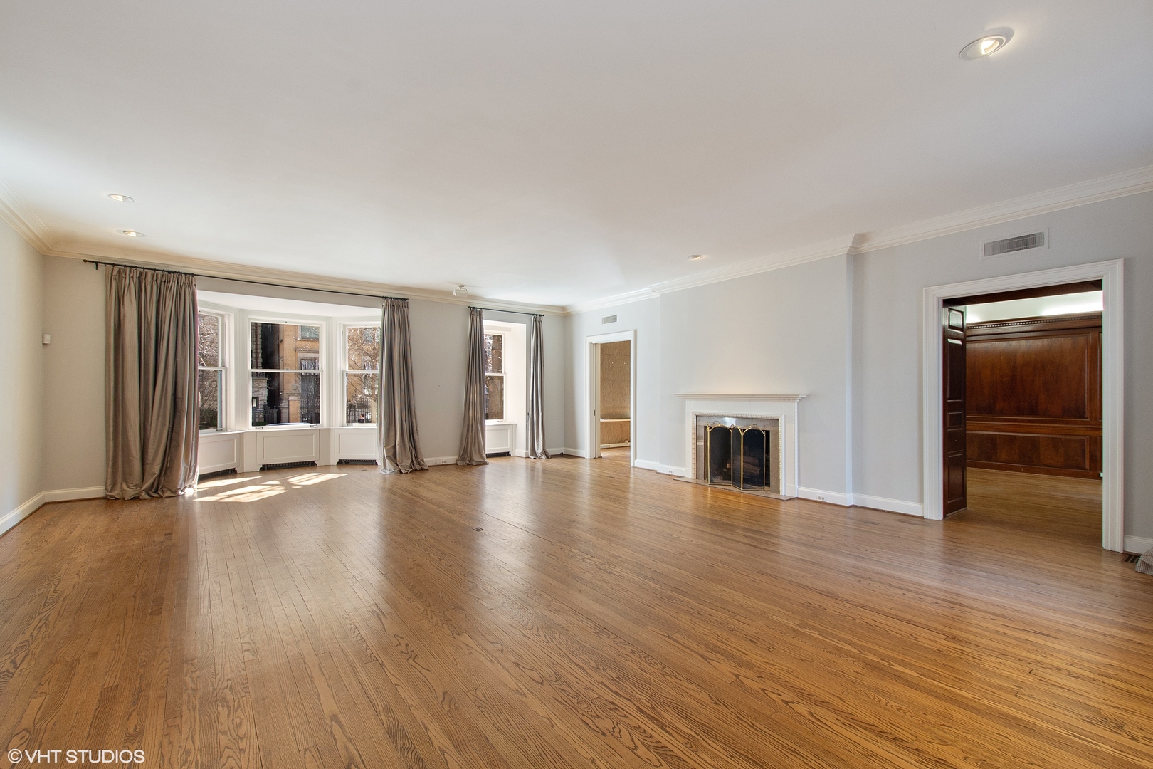 1442 North Astor Street Chicago, IL 60610 - Photo 16 of 55 an empty room with wooden floor and fireplace