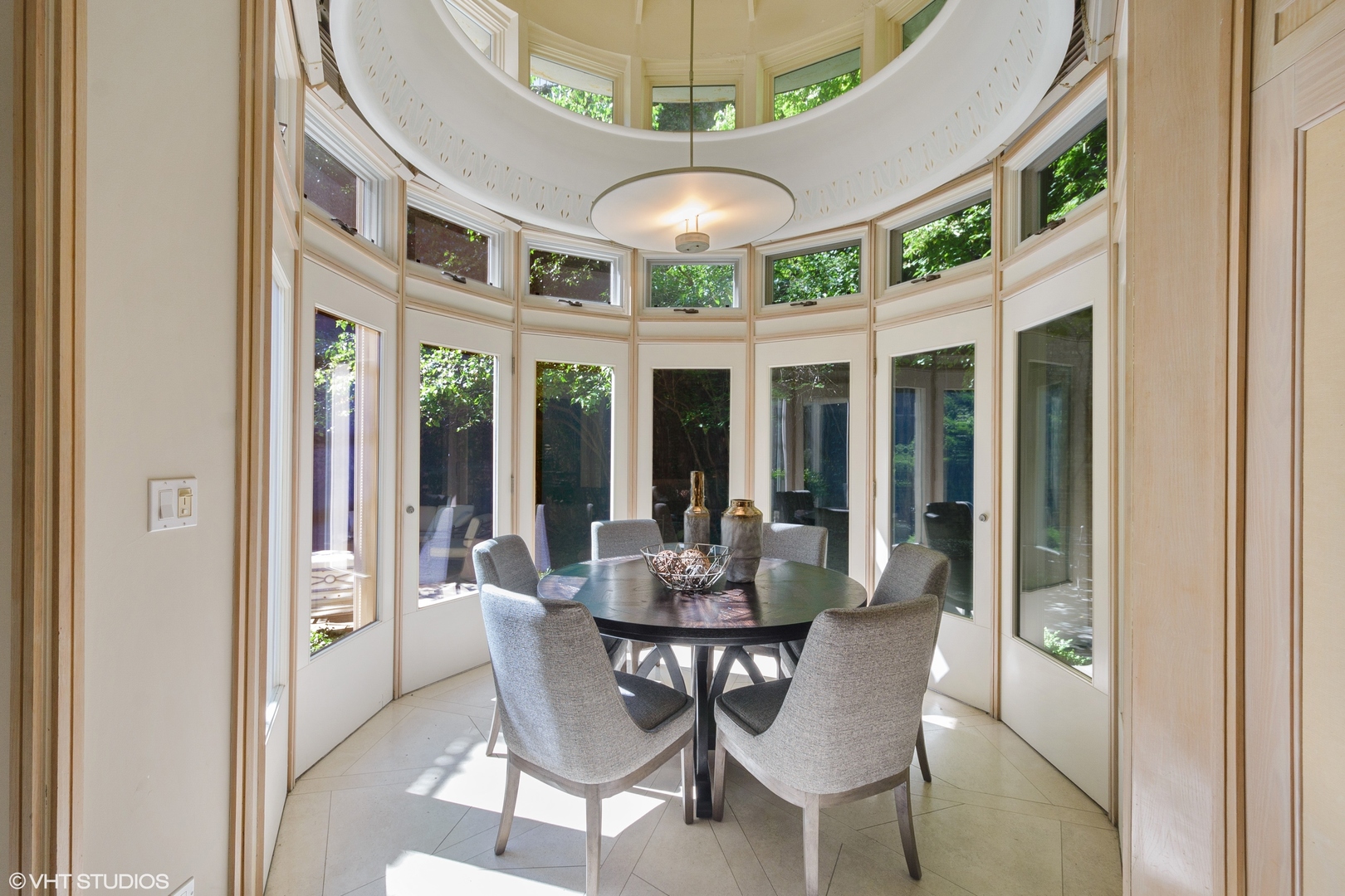 1442 North Astor Street Chicago, IL 60610 - Photo 22 of 55 a dining room with furniture a chandelier and large windows