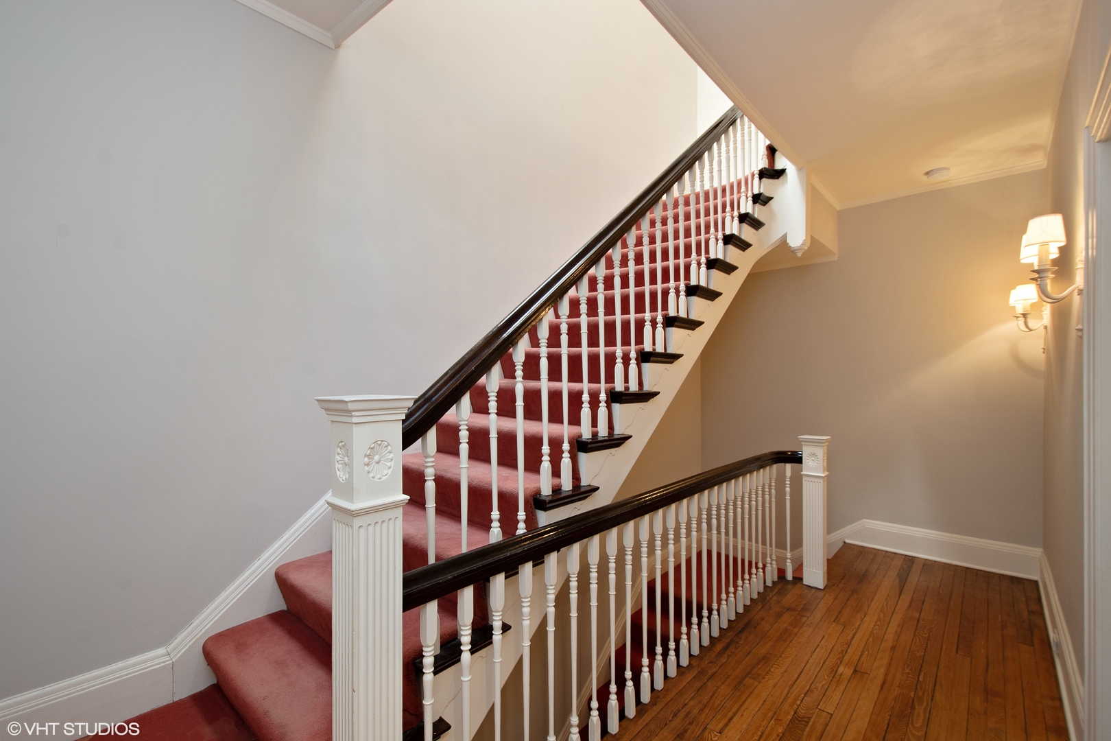 1442 North Astor Street Chicago, IL 60610 - Photo 32 of 55 a view of staircase with wooden floor and white walls