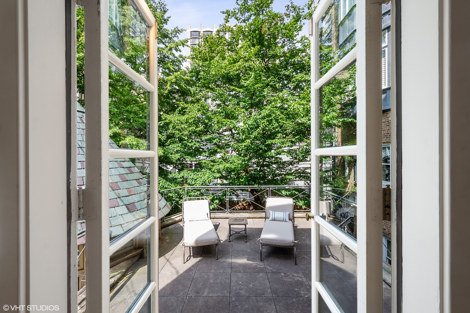 1442 North Astor Street Chicago, IL 60610 - Photo 40 of 55 a balcony with chairs and potted plants