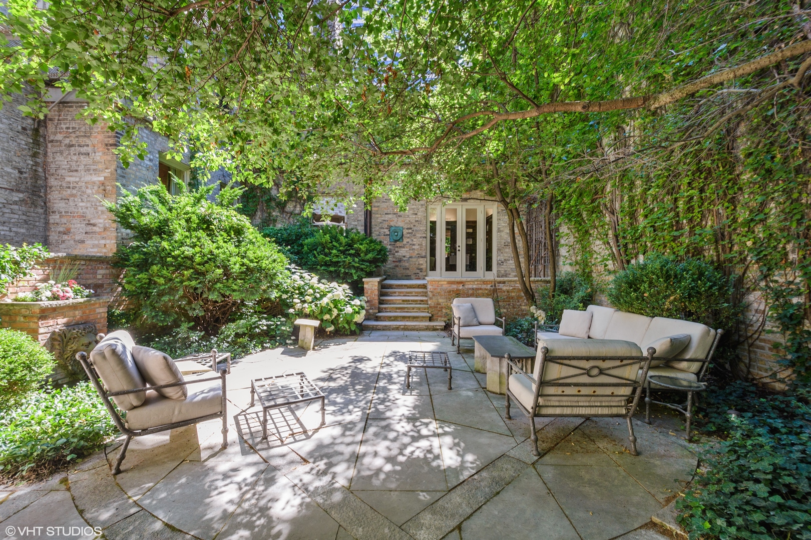 1442 North Astor Street Chicago, IL 60610 - Photo 42 of 55 a view of backyard with outdoor seating and trees