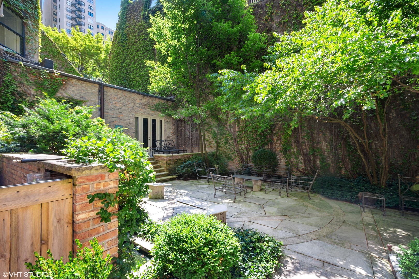 1442 North Astor Street Chicago, IL 60610 - Photo 50 of 55 a view of backyard with plants and trees
