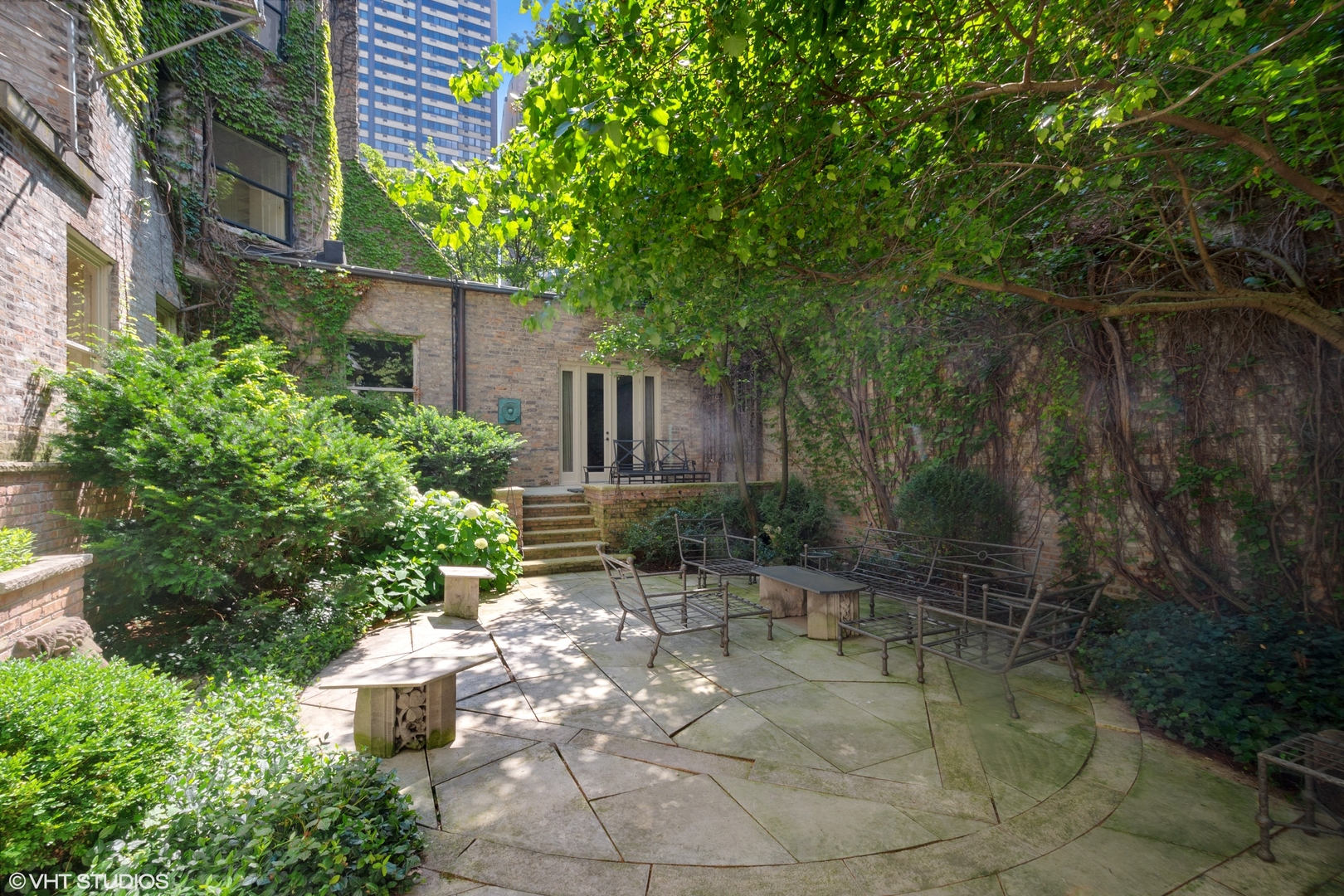 1442 North Astor Street Chicago, IL 60610 - Photo 53 of 55 a view of backyard with plants and outdoor seating