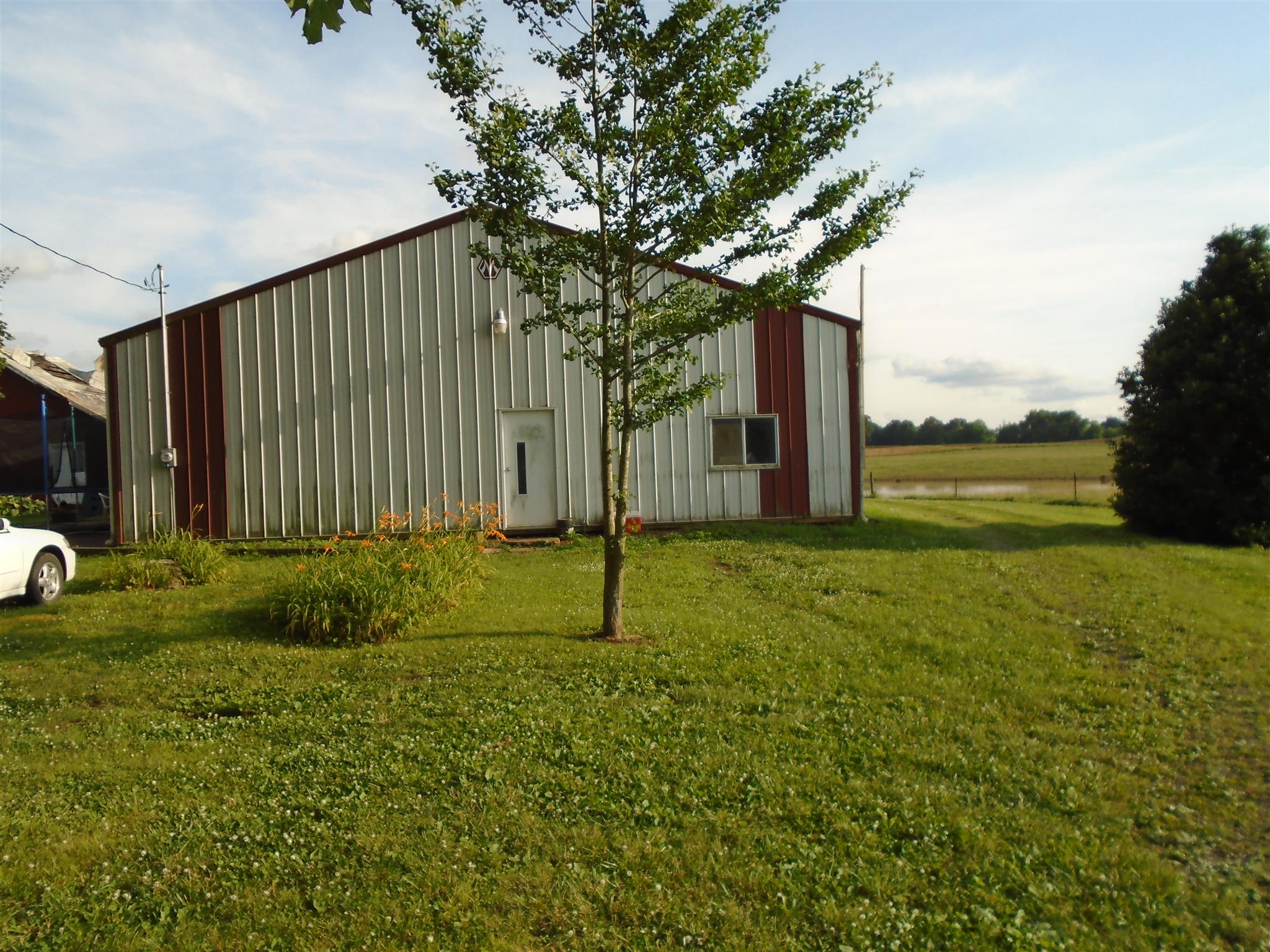 4937 Barren Plains Road Springfield, TN 37172 - Photo 6 of 9 a house with huge green field in front of it