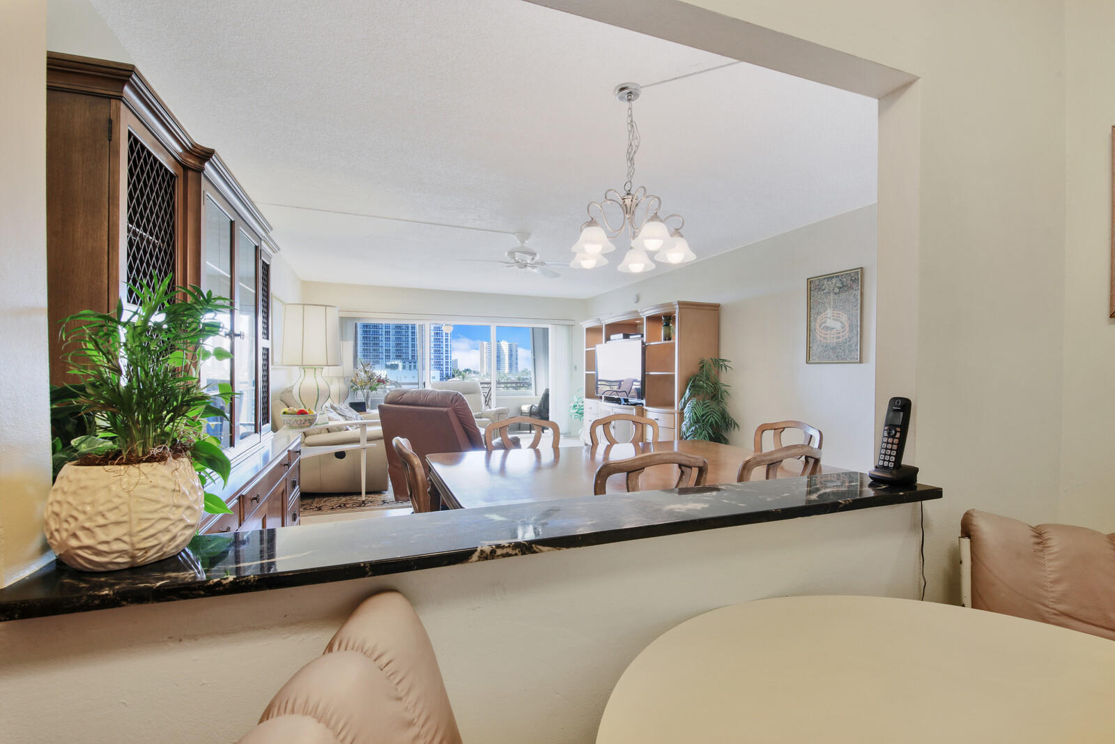 401 Briny Avenue, Unit 516 Pompano Beach, FL 33062 - Photo 11 of 38 a view of a livingroom with furniture and chandelier