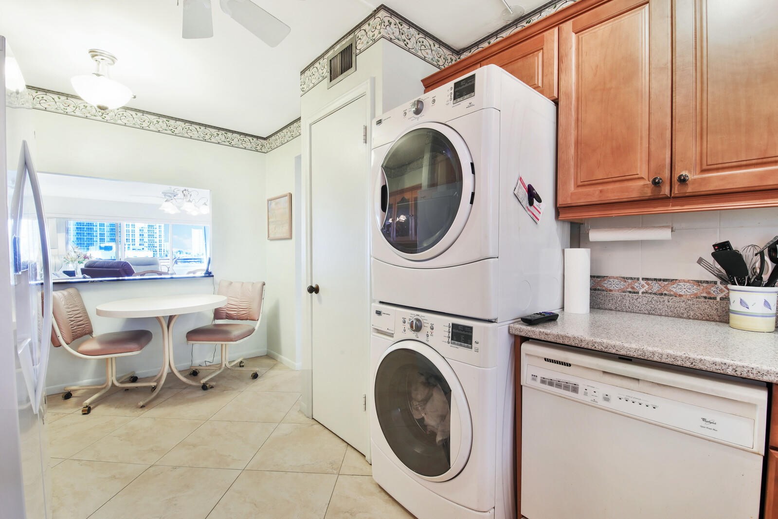 401 Briny Avenue, Unit 516 Pompano Beach, FL 33062 - Photo 14 of 38 a view of a kitchen with stainless steel appliances granite countertop a sink and cabinets
