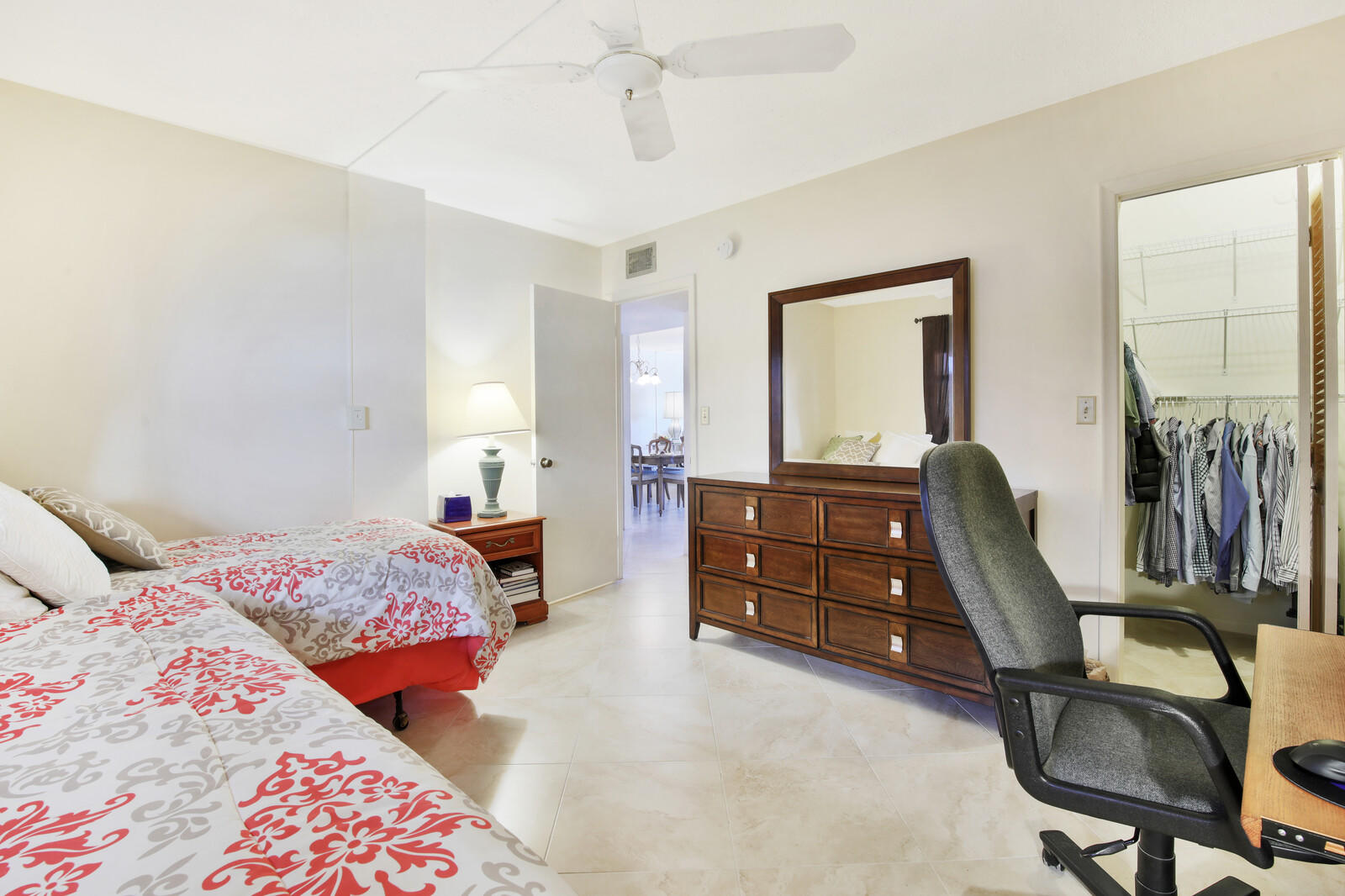 401 Briny Avenue, Unit 516 Pompano Beach, FL 33062 - Photo 19 of 38 a bedroom with a bed and furniture