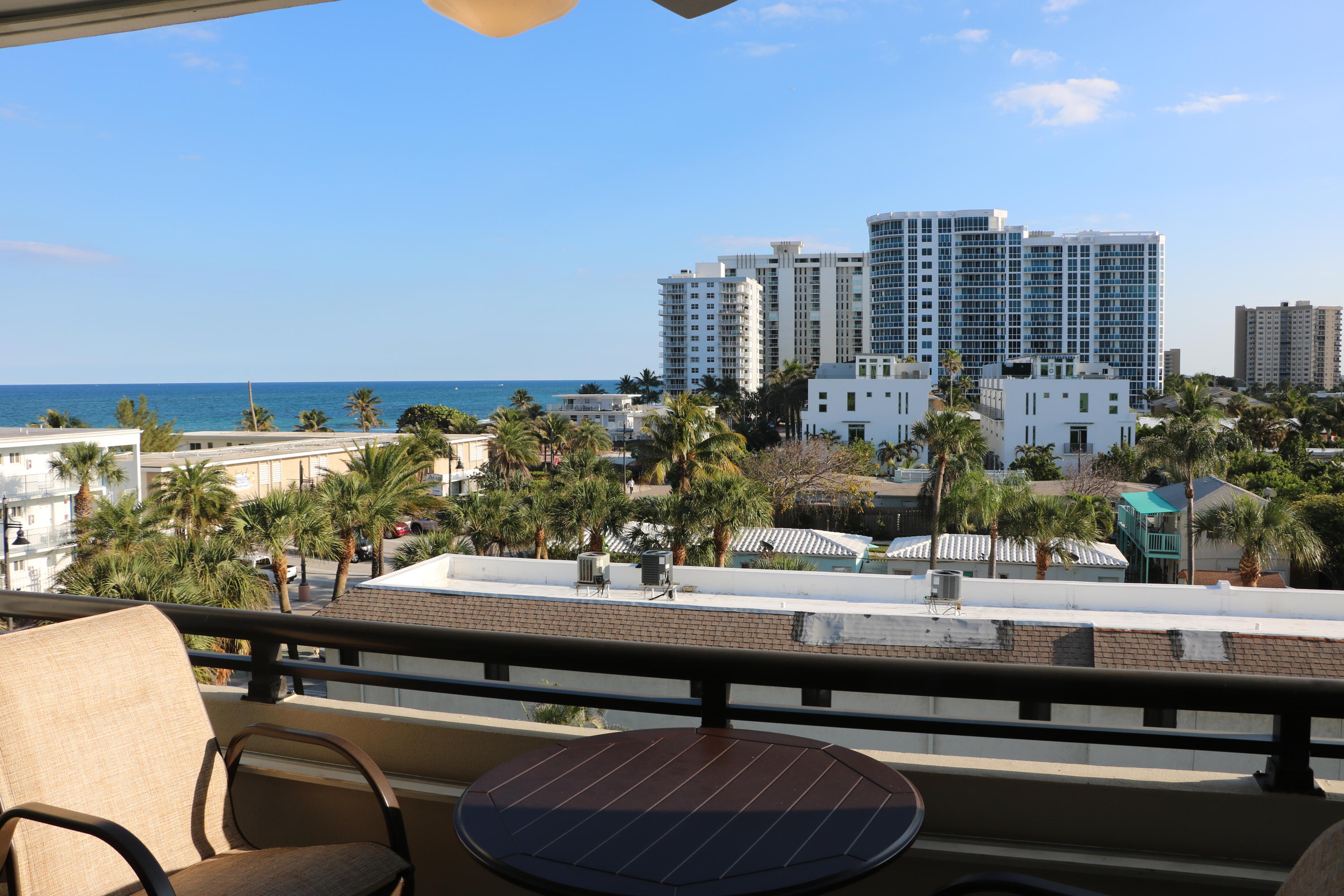 401 Briny Avenue, Unit 516 Pompano Beach, FL 33062 - Photo 3 of 38 a view of swimming pool from a balcony