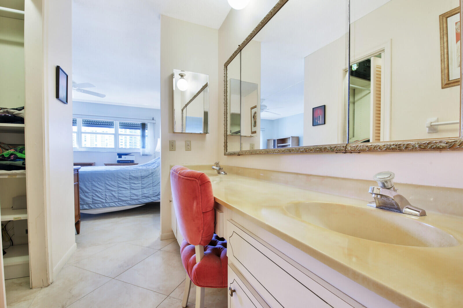 401 Briny Avenue, Unit 516 Pompano Beach, FL 33062 - Photo 27 of 38 a spacious bathroom with a tub sink and mirror