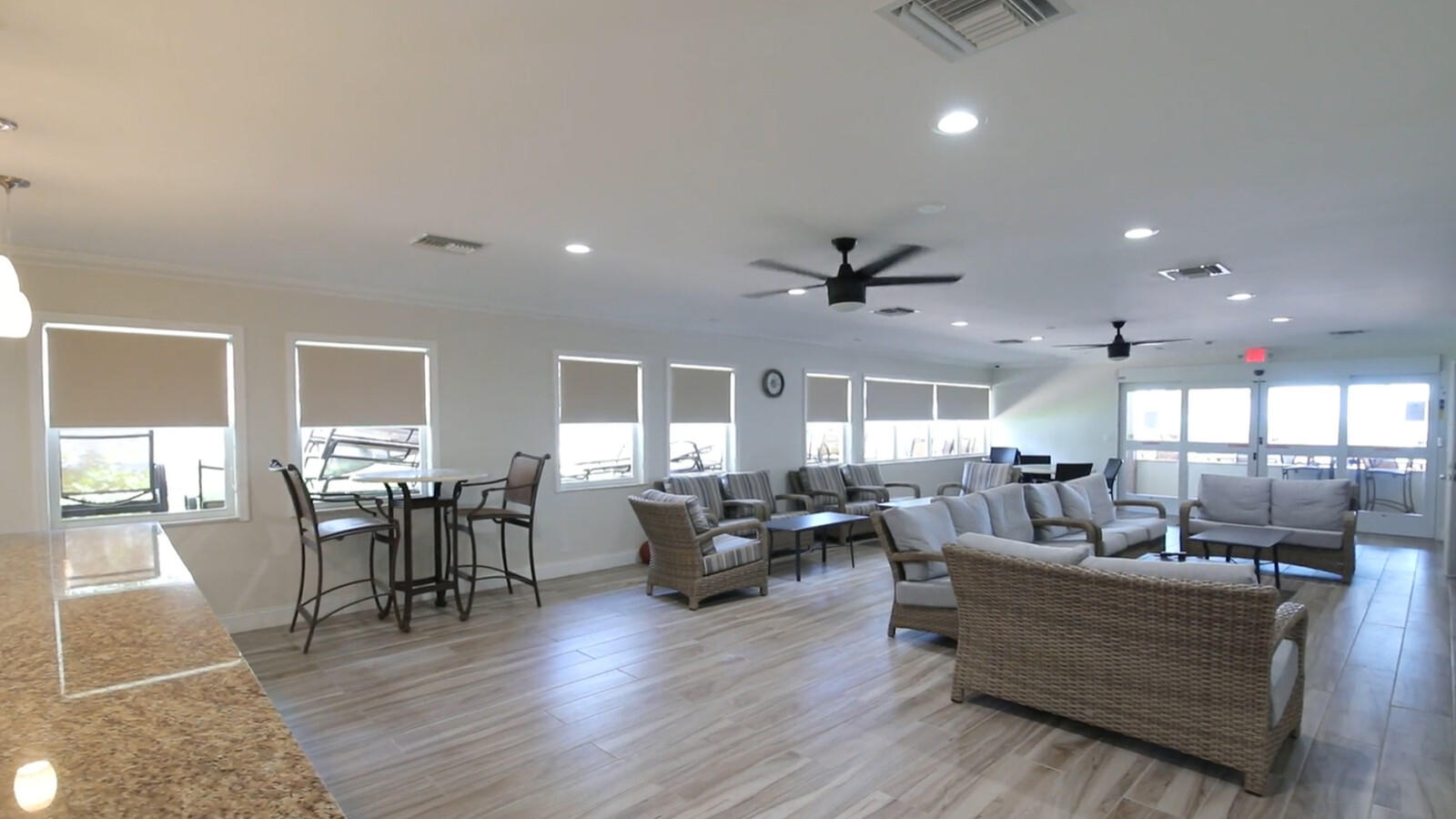 401 Briny Avenue, Unit 516 Pompano Beach, FL 33062 - Photo 35 of 38 a living room with furniture and a wooden floor