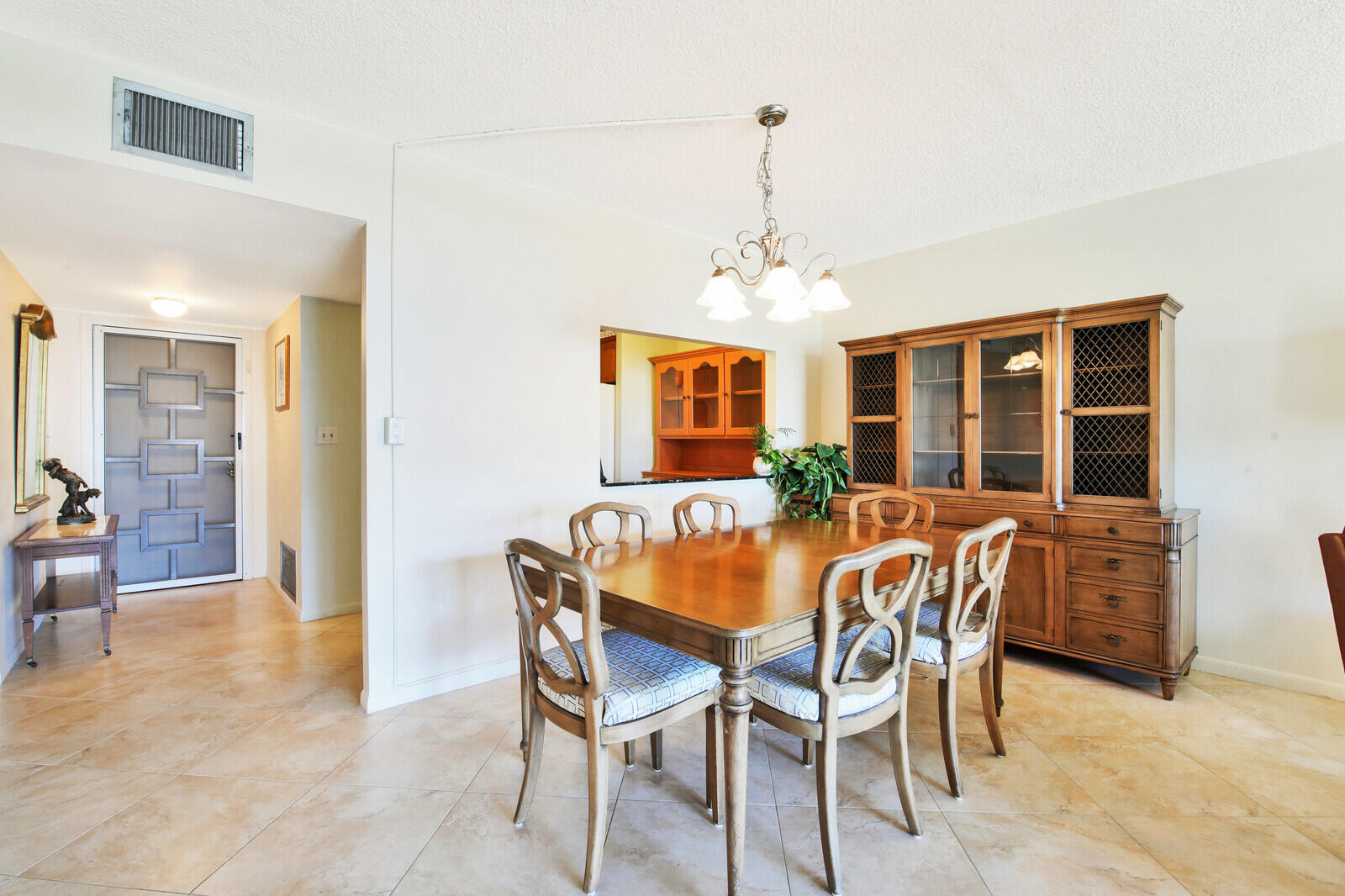401 Briny Avenue, Unit 516 Pompano Beach, FL 33062 - Photo 5 of 38 a dining room with furniture and window