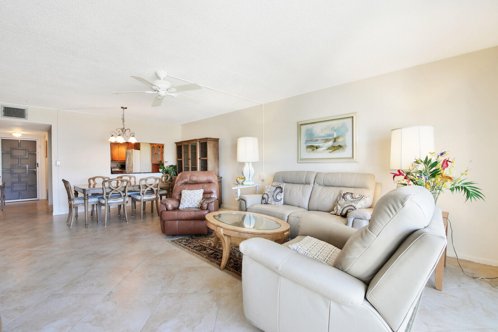 401 Briny Avenue, Unit 516 Pompano Beach, FL 33062 - Photo 8 of 38 a living room with furniture and wooden floor