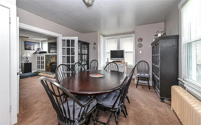a dining room with furniture and window