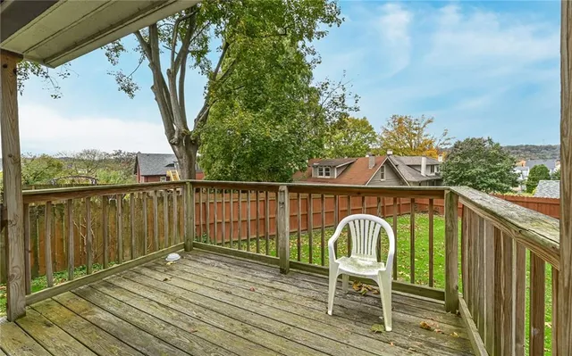 a view of a chair and table on the wooden floor