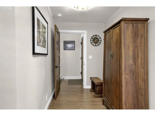 a view of an entryway with wooden floor