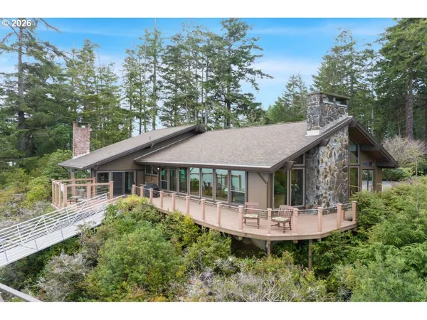 a front view of a house with a yard table and chairs