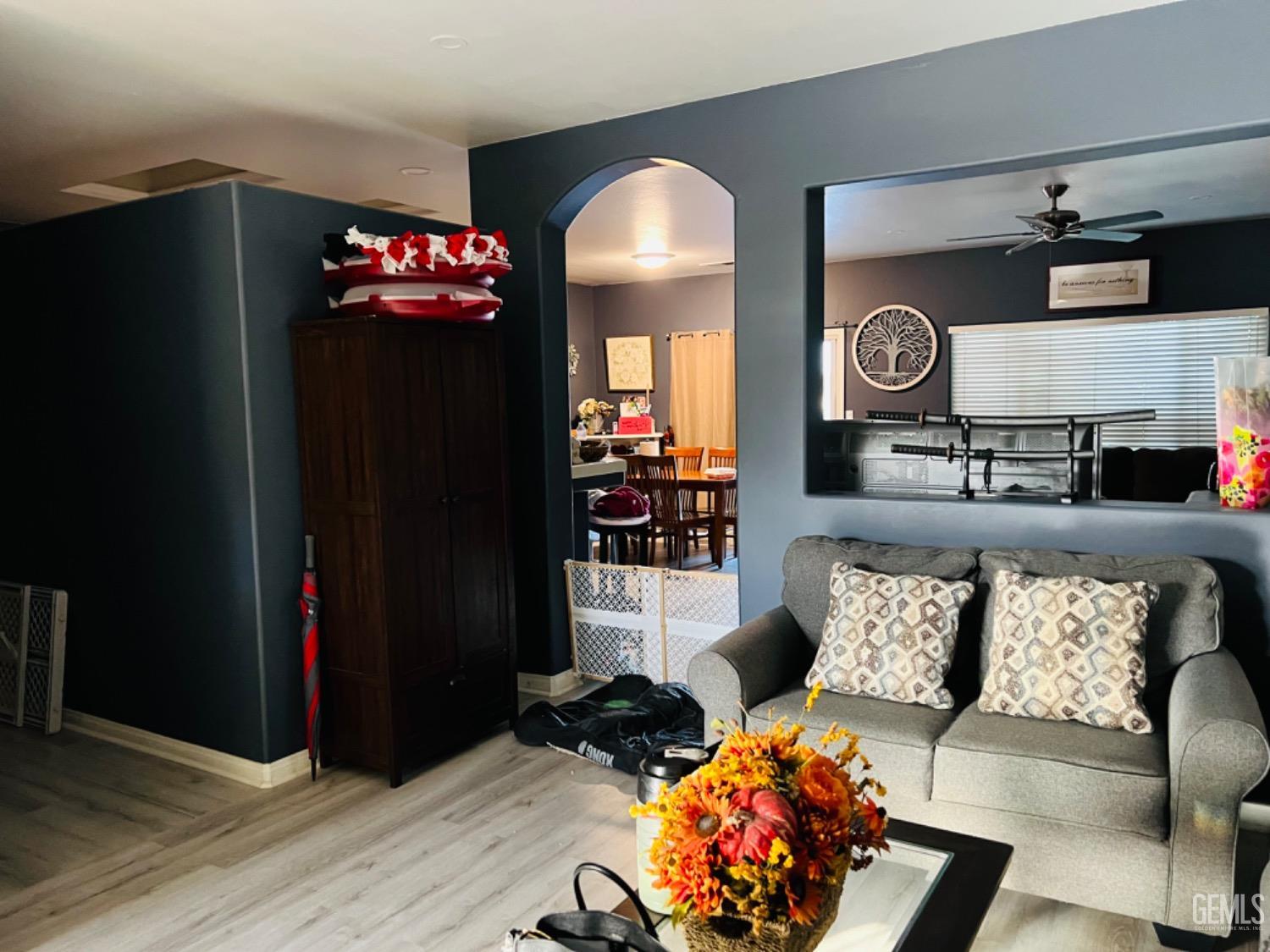 Undisclosed Address Bakersfield, CA 93313 - Photo 3 of 13 a living room with furniture and a fireplace