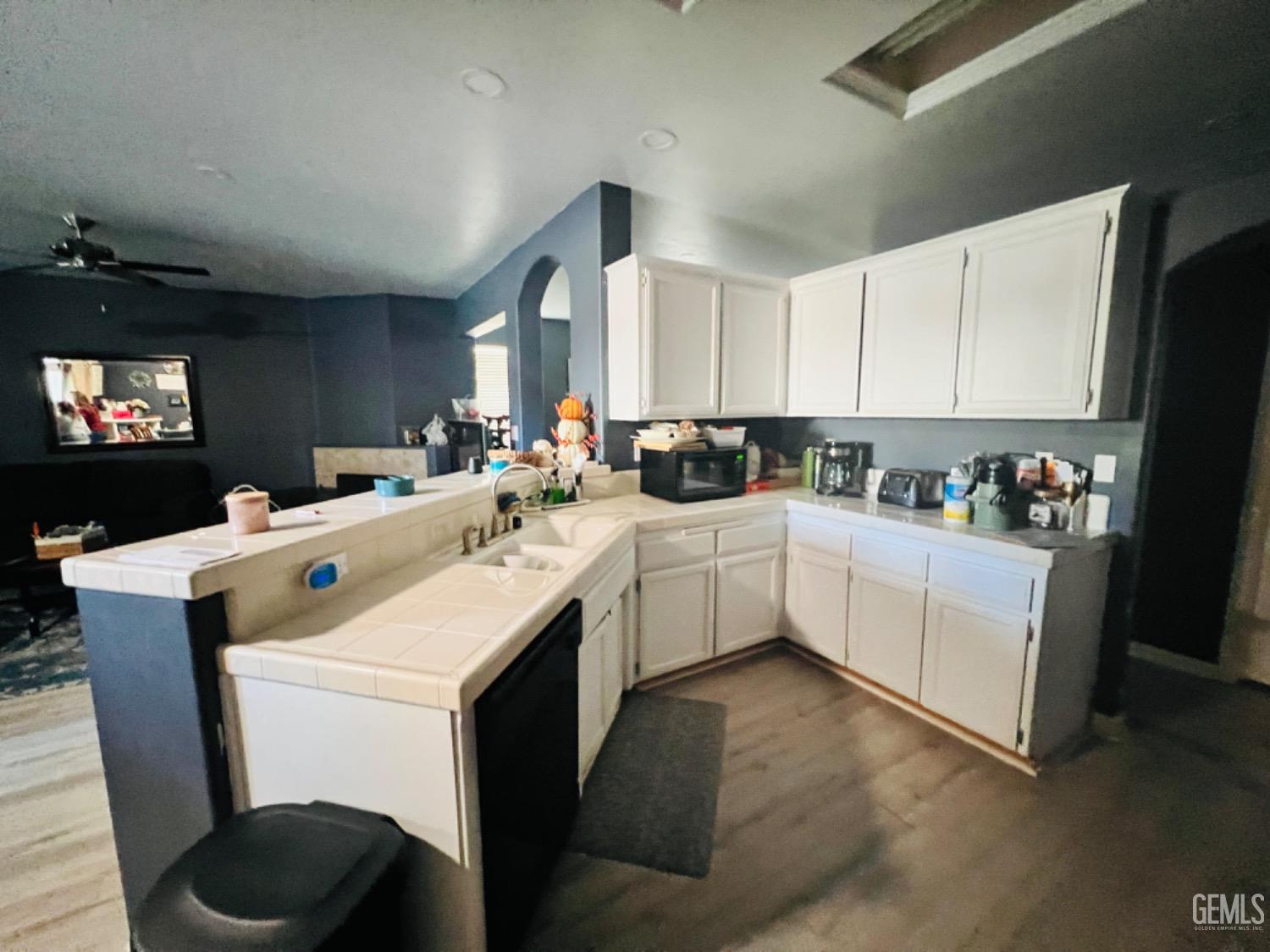 Undisclosed Address Bakersfield, CA 93313 - Photo 6 of 13 a kitchen that has a sink and a stove in it