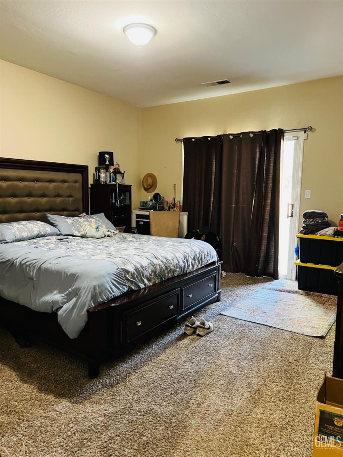 Undisclosed Address Bakersfield, CA 93313 - Photo 7 of 13 a bedroom with a bed and a dresser