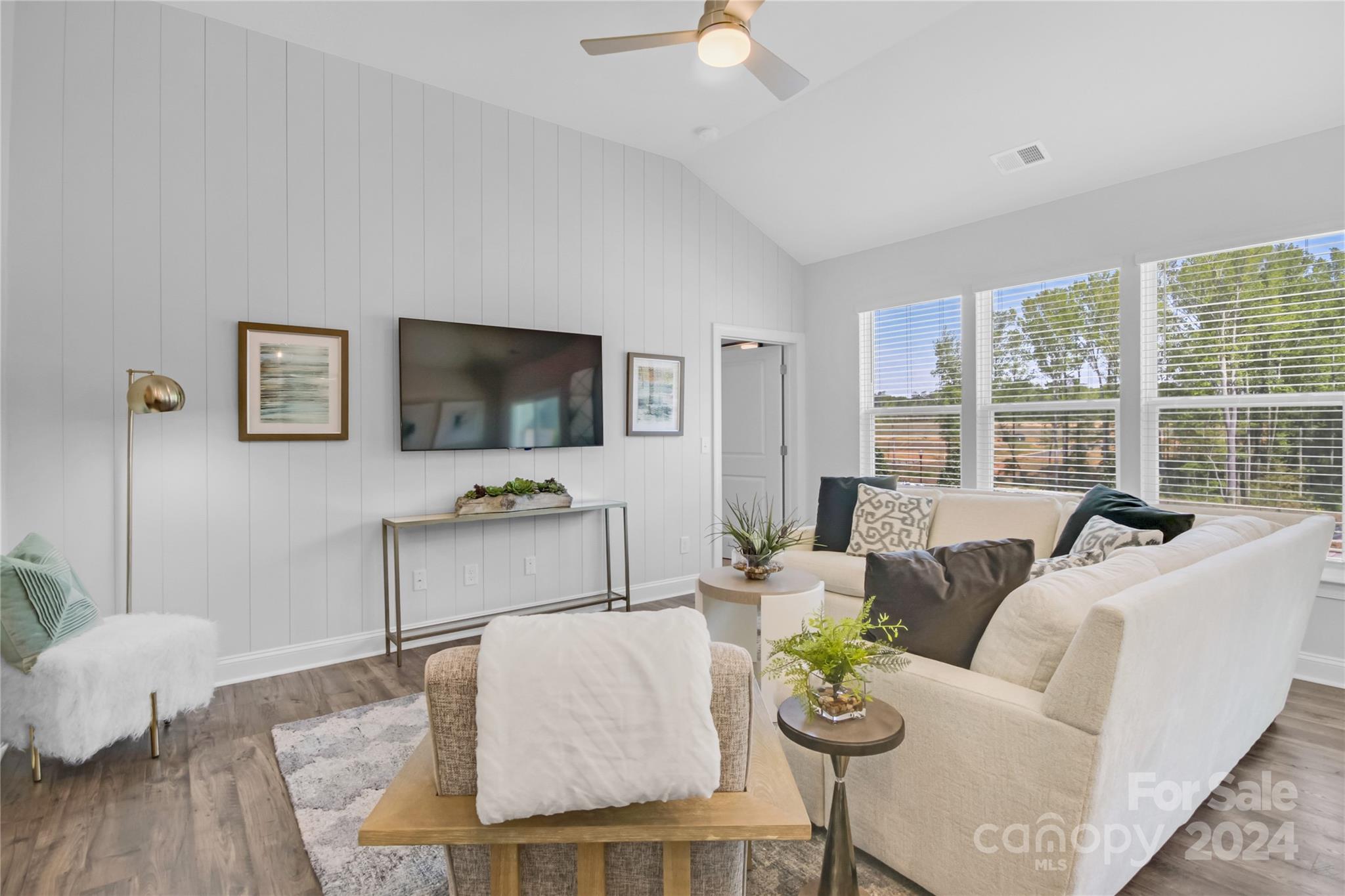 3159 Laurel Brook Drive Denver, NC 28037 - Photo 11 of 30 a living room with furniture and a flat screen tv
