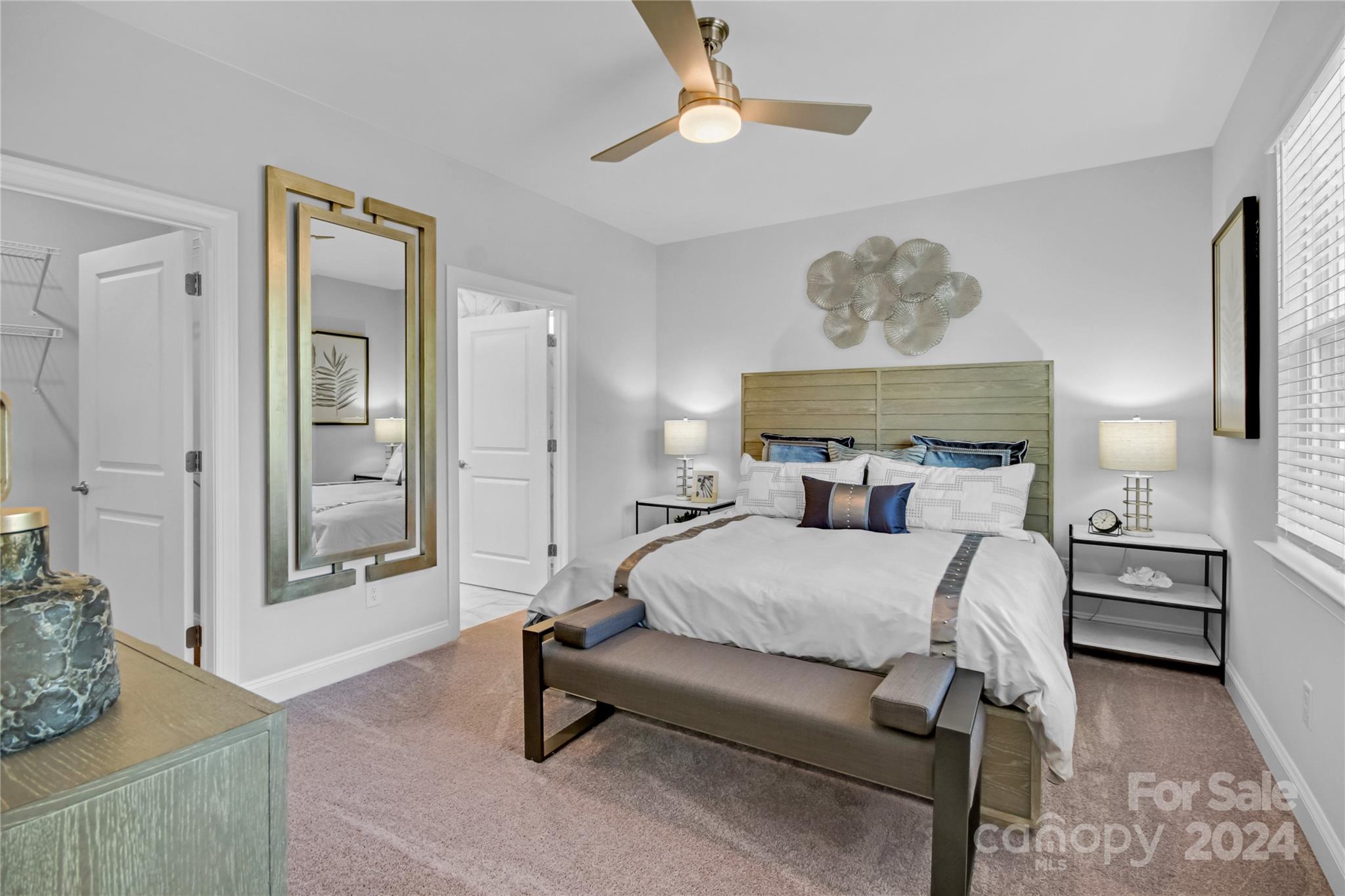 3159 Laurel Brook Drive Denver, NC 28037 - Photo 14 of 30 a bedroom with a bed mirror and painting on the wall
