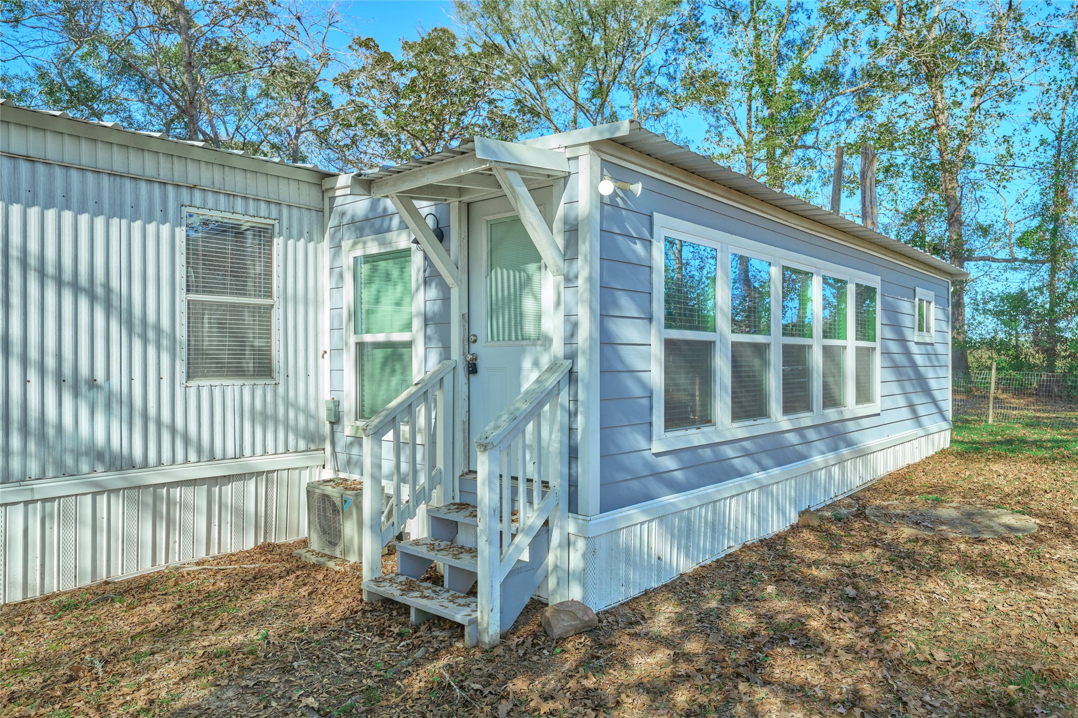 17381 FM 1484 Road Conroe, TX 77303 - Photo 13 of 37 a view of wooden house with a yard