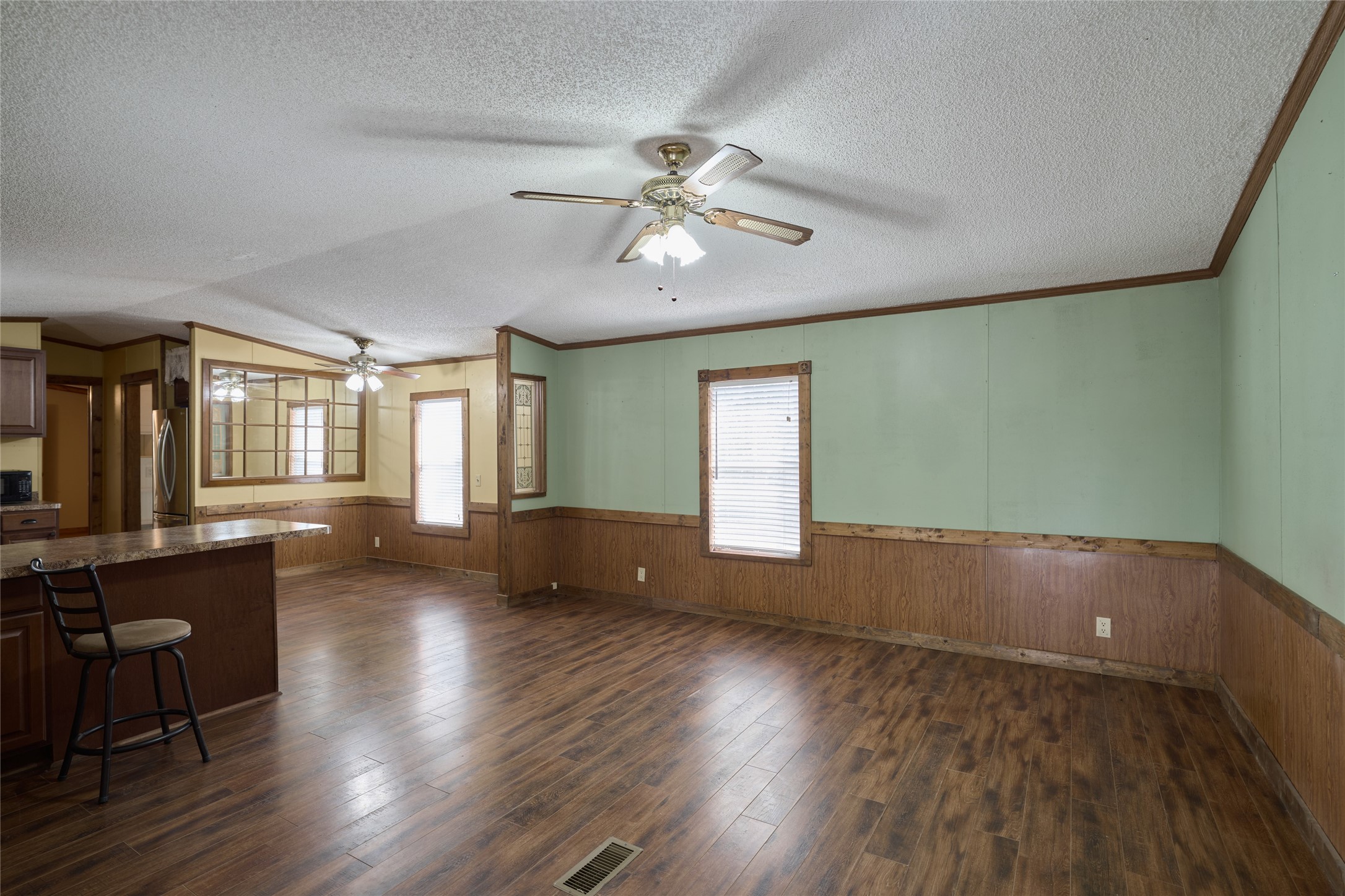 17381 FM 1484 Road Conroe, TX 77303 - Photo 15 of 37 a view of empty room with wooden floor and fan