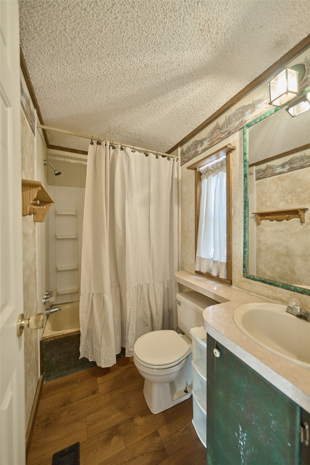 17381 FM 1484 Road Conroe, TX 77303 - Photo 34 of 37 a bathroom with a granite countertop bathtub sink vanity mirror and toilet
