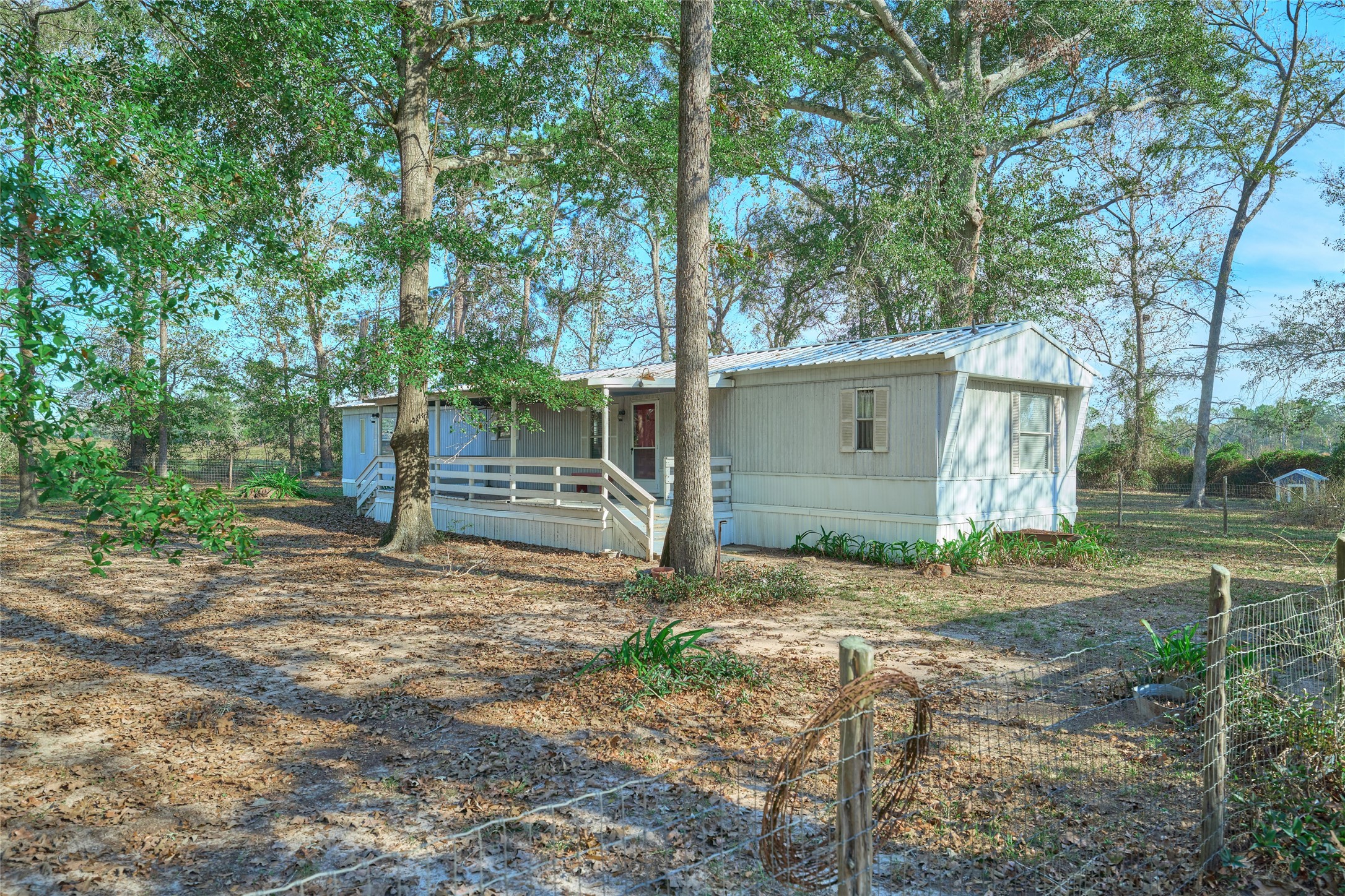 17381 FM 1484 Road Conroe, TX 77303 - Photo 5 of 37 a backyard of a house with lots of green space