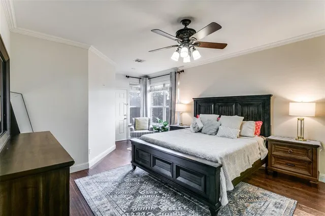 a spacious bathroom with a tub shower and windows