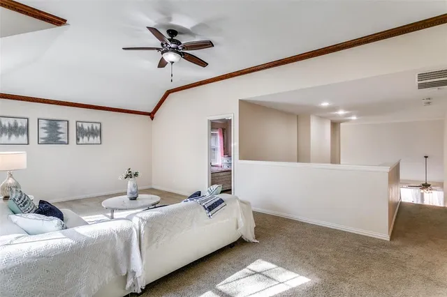a living room with furniture and a rug