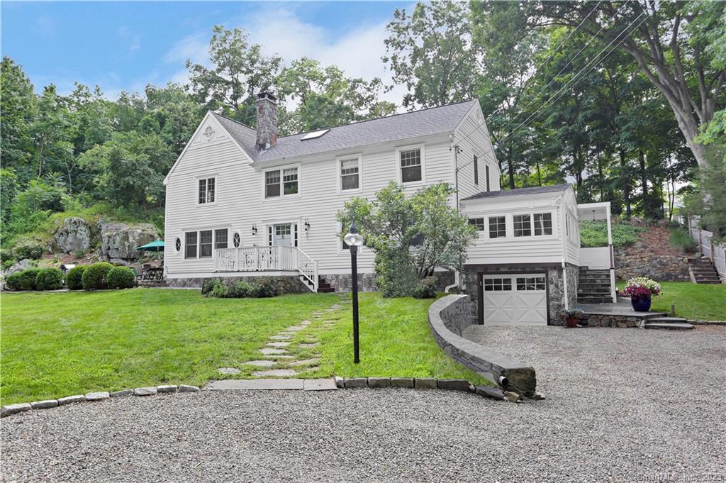 a view of a house with backyard porch and garden