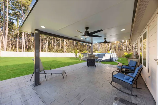 a view of a backyard with large trees