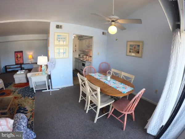 a dining room with a table and chairs