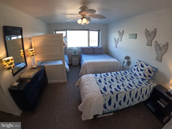 a bedroom with bed and window