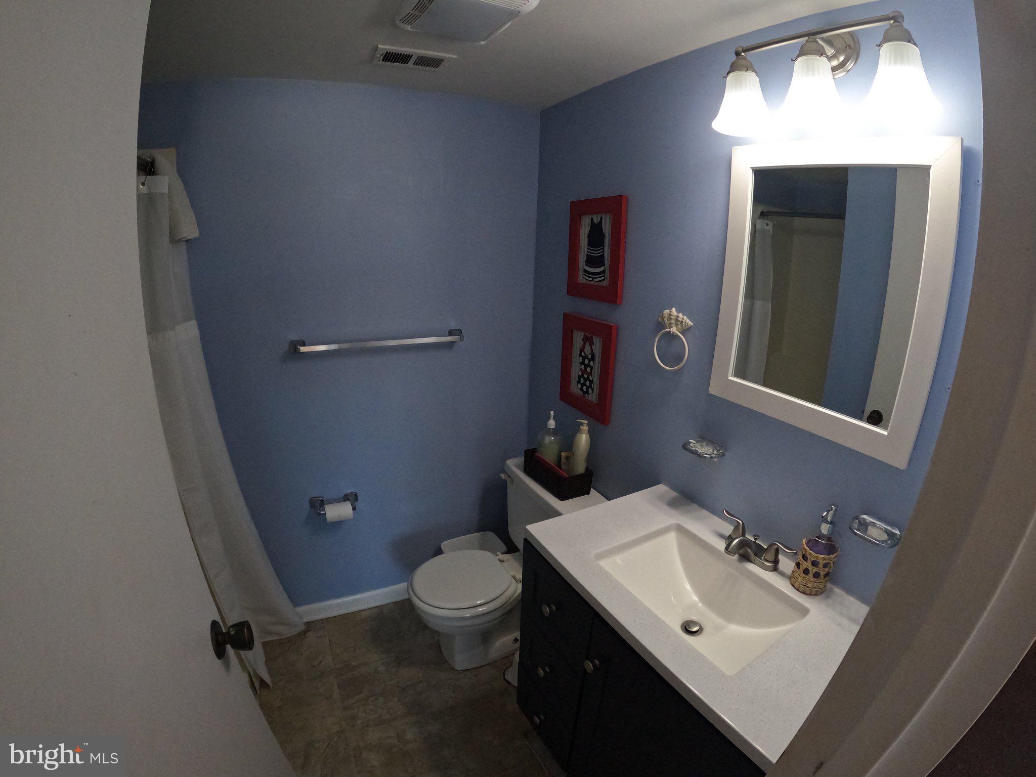 13907 Sand Dune Road, Unit 9A Ocean City, MD 21842 - Photo 23 of 28 Charming blue-hued bathroom retreat.