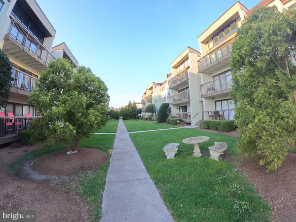 a view of a building with a yard