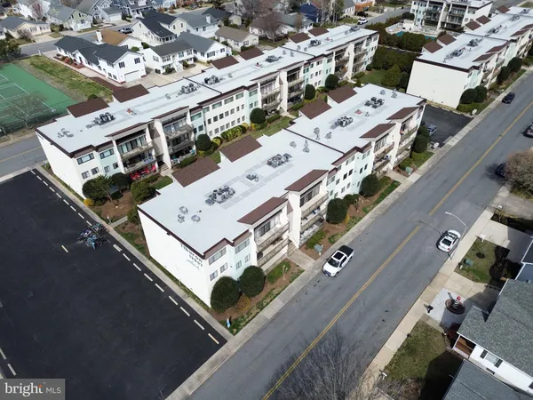 an aerial view of a building with a street