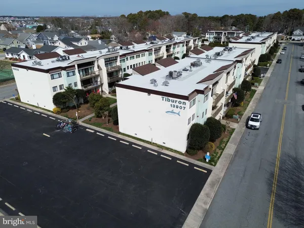 an aerial view of a house with a parking space