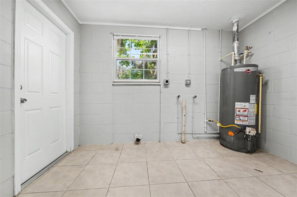 1109 Inland Street Leesburg, FL 34748 - Photo 13 of 15 a view of a storage & utility room with closet window