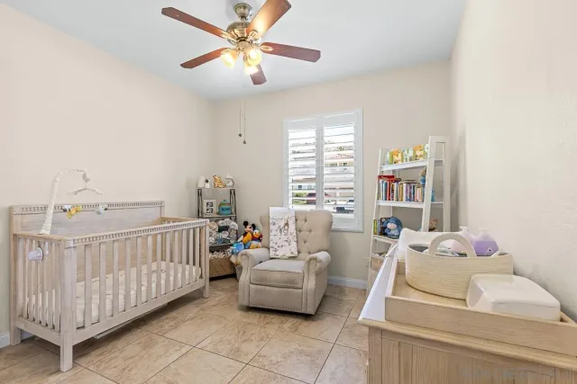 a bedroom with furniture and a window