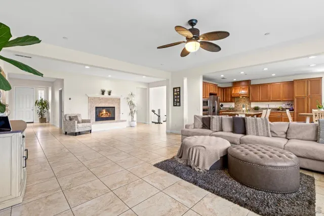 a living room with furniture and kitchen view